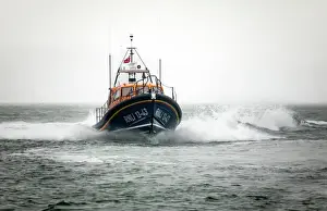 Clifden Shannon class lifeboat St Christopher 13-43 at sea during trials in Poole Bay. Shot from Shell Bay beach, Studland