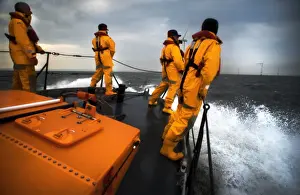 Crew members stood on the fore deck of the Hoylake lifeboat Lady of Hilbre
