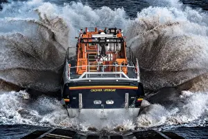 Cromer Tamar class lifeboat Lester 16-07 launching down the slipway, lots of white spray