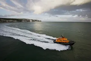 Dover severn class lifeboat City of London II 17-09 moving from left to right, white cliffs in the background
