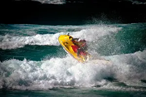 Lifeguard on a rescue watercraft (RWC) in the surf at Perranporth beach, Cornwall