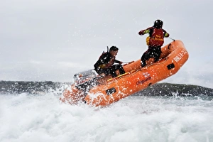 Two lifeguards on an arancia inshore rescue boat at Harlyn Bay, Cornwall