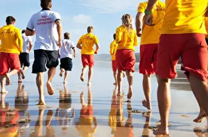 Lifeguards up early for a mornings training session on Perranporth beach