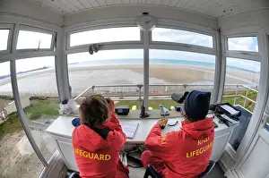 Life Guard Prints: Two lifeguards monitoring the sea at a beach in Jersey from lifeguard hut
