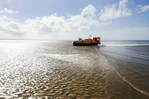 New Brighton hovercraft Hurley Spirit H-005 moving right to left across sand flats