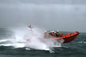Poole Atlantic 85 class inshore lifeboat Sgt Bob Martin B-826 in rough seas heading from left to right