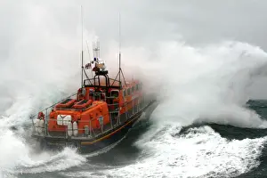 Poole Tyne class lifeboat City of Sheffield 47-023 in rough seas Lifeboat heading through a breaking wave, lots of white spray. Used in Daily Telegraph 18 / 06 / 11
