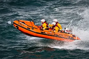 Port Isaac D-class inshore lifeboat Copeland Bell D-707. Silver gallantry medal awardee Damien Bolton on board with Bronze medal awardees Nicola-Jane Bradbury and Matthew Main crewing