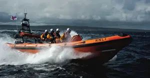 Red Bay Altantic 85 inshore lifeboat Geoffrey Charles B-843. Lifeboat moving from left to right at speed, four crew on board