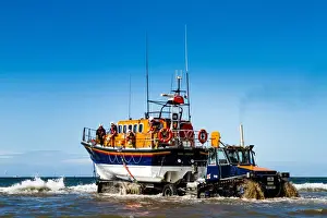 Rhyl Mersey class lifeboat Lil Cunningham 12-24 being launched by tractor