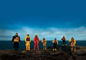 RNLI lifejackets through the ages photo used in Lifeboat magazine Spring 2012. Photo shows the evolution of lifejackets used by the RNLI. From left to right: cork, kapok, beaufort, old ALB, old ILB, new ILB, new ALB