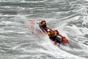 Inshore Lifeboat Prints: St Agnes d-class inshore lifeboat Blue Peter IV D-641 heading through a breaking wave