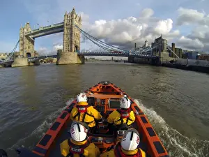 Tower E-class lifeboat Hurley Burly E-07 heading along the Thames towards Tower Bridge