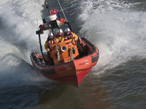 Tower Pier E class lifeboat powering along theThames at high spe