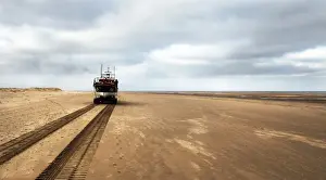 Wells Mersey class lifeboat Doris M Mann of Ampthill 12-003 being launched by carriage along the beach